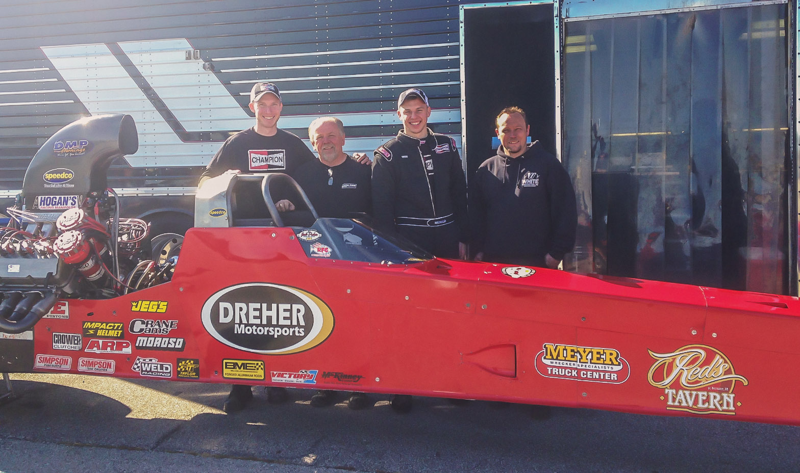 Kyle and Corey stand with car owners Randy and Jared Dreher after Corey completed his license upgrade to an A/fuel dragster