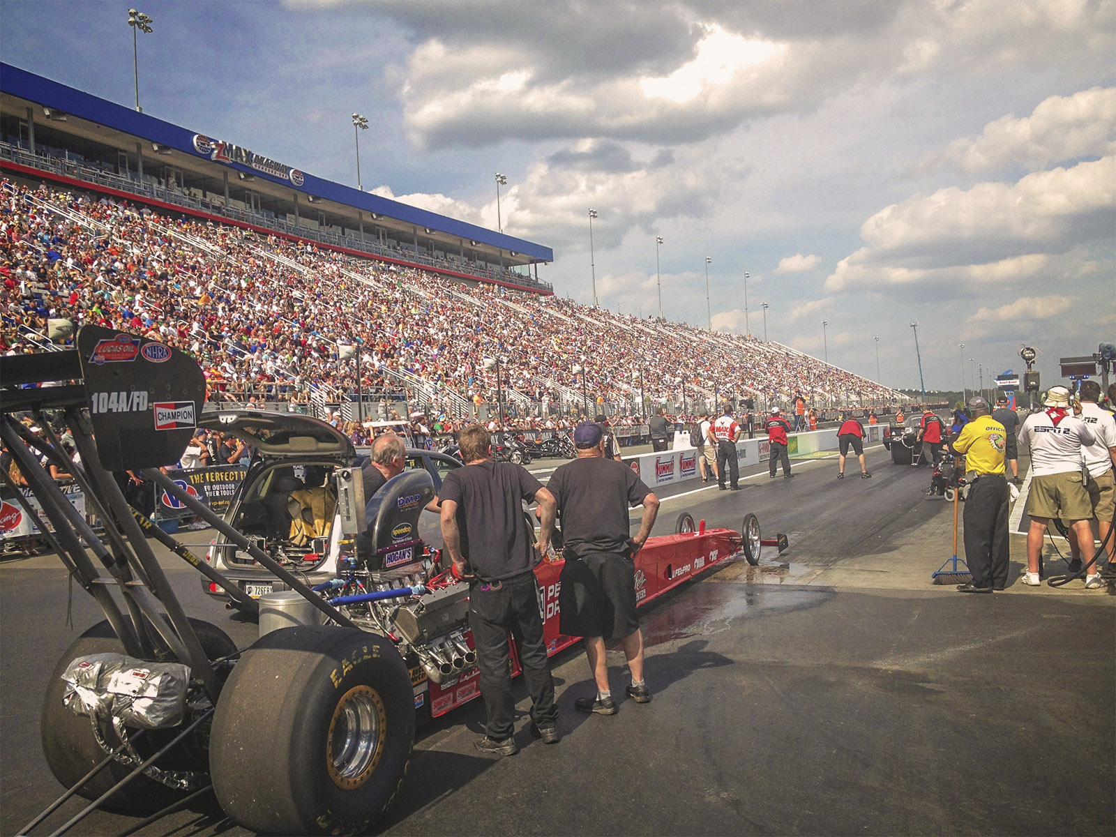 Corey Michalek patiently awaits the final round inside the Champion Spark Plugs / Dreher Motorsports A/fuel dragster in front of a packed house at ZMax Dragway.