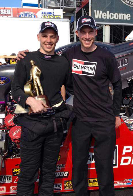 Kyle and Corey celebrate the victory in the staging lanes with their first Wally trophy.