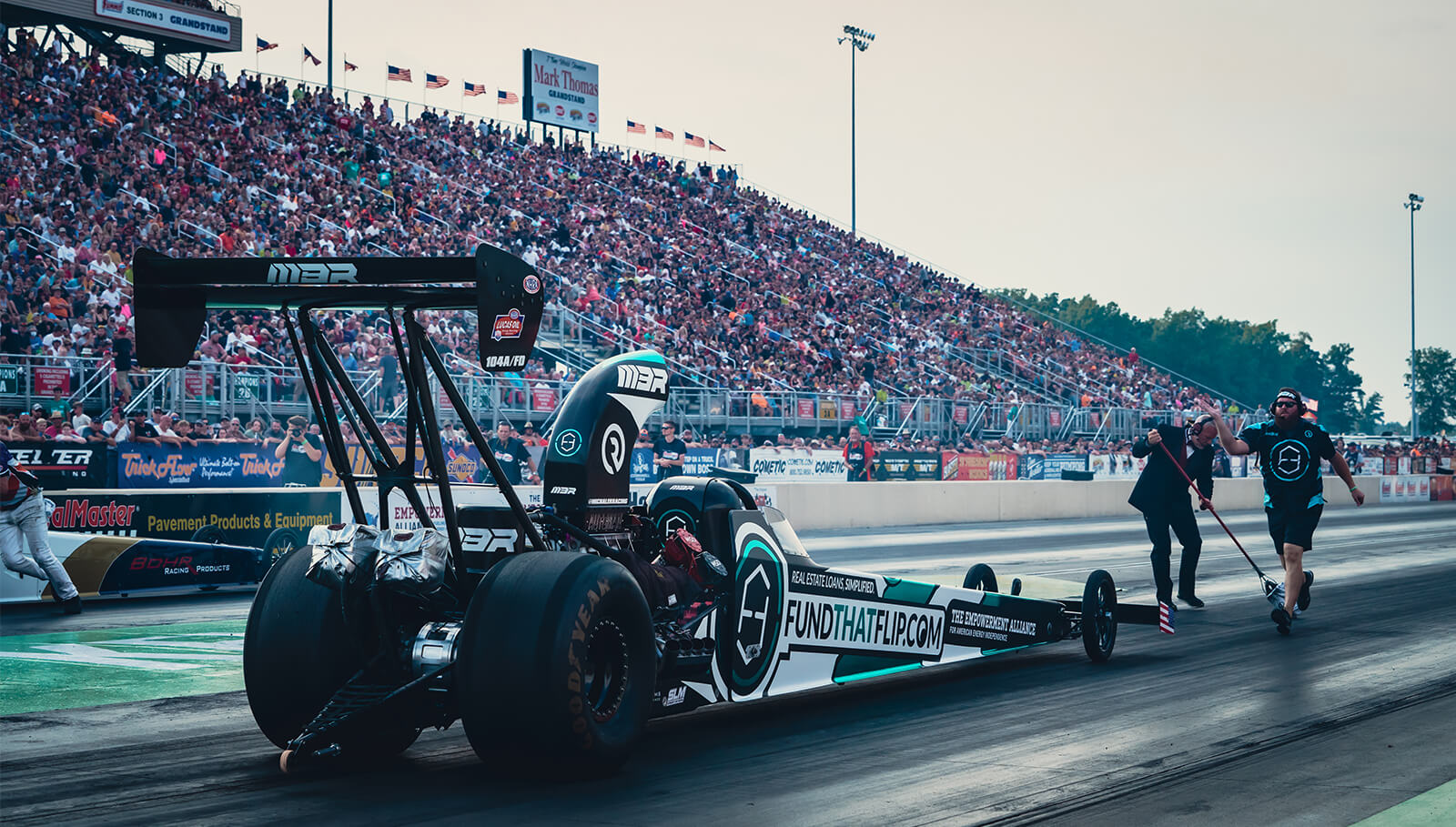 The Fund That Flip / Empowerment Alliance A/fuel dragster was on display in front of over 50,000 people at the 44th running of the Kelly Services Night Under Fire.